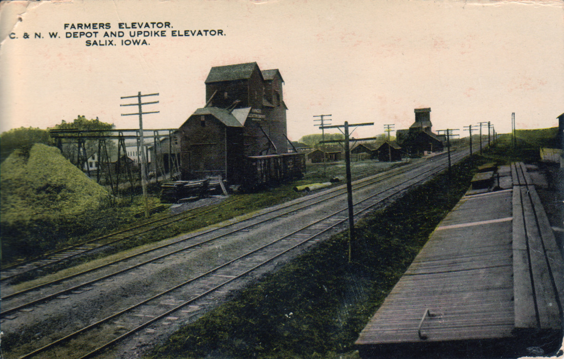 Historic postcard of Farmers Elevator, C. & N.W. Depot and Updike Elevator in Salix, Iowa